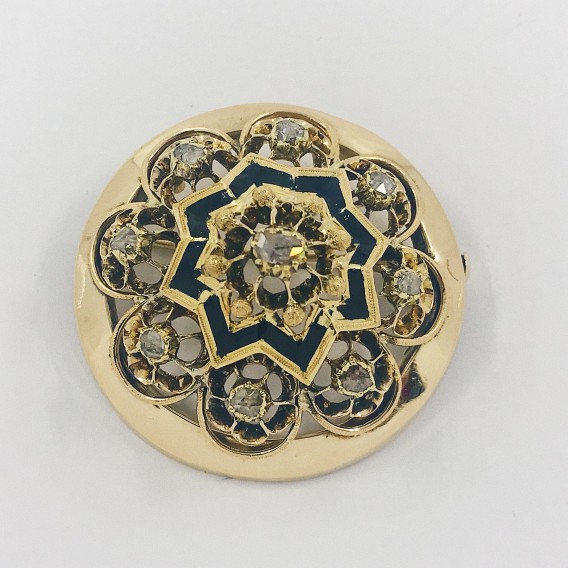 Broche circular de oro con diamantes