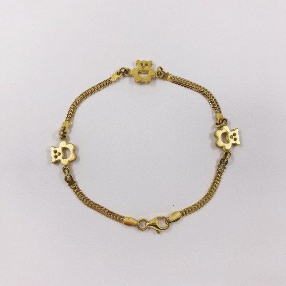 Pulsera con ositos en oro 18kt.