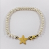Pulsera de perlas con estrella en oro 18kt.